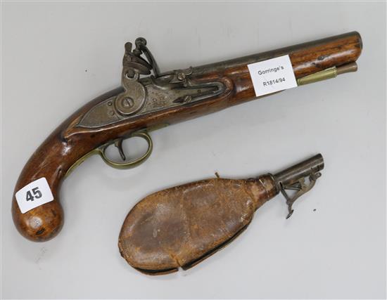 A flintlock pistol and powder flask